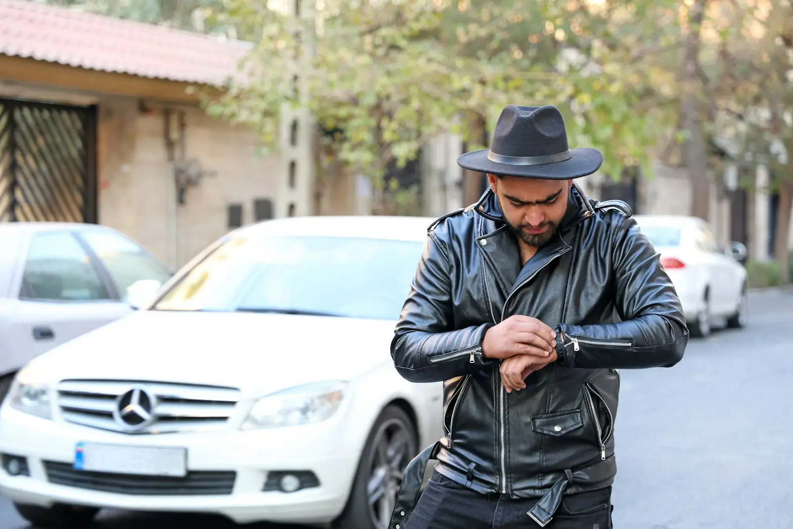 Business owner checking his watch on the way to work