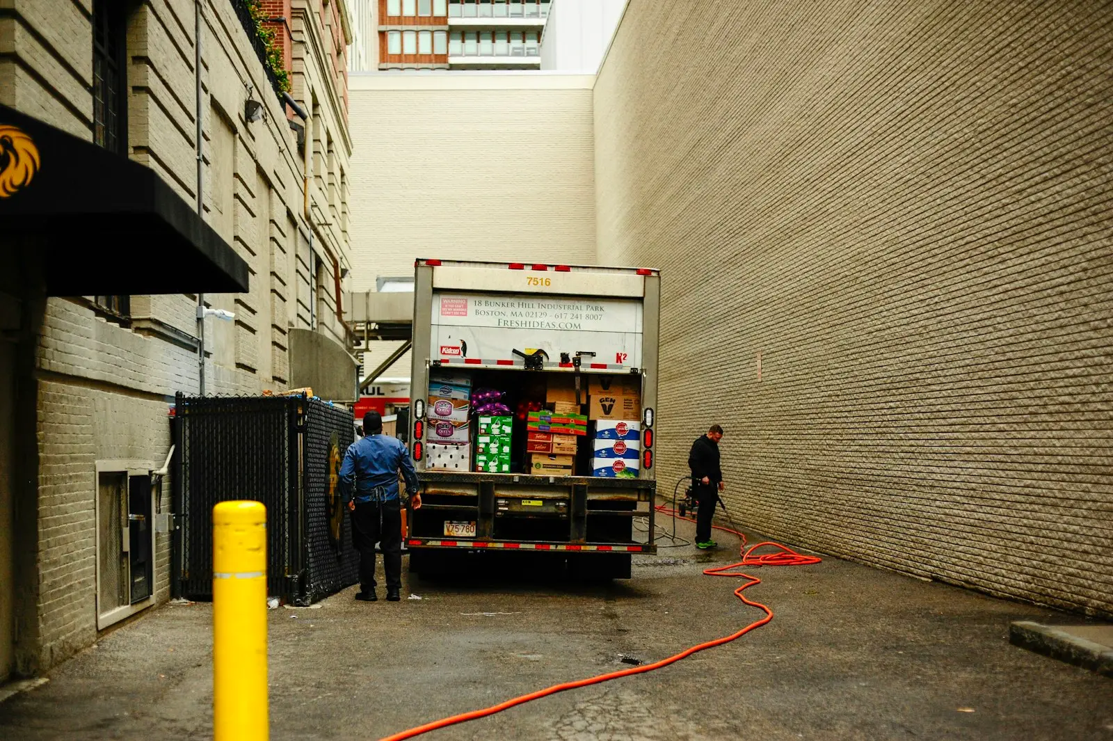 Two men unloading a delivery truck